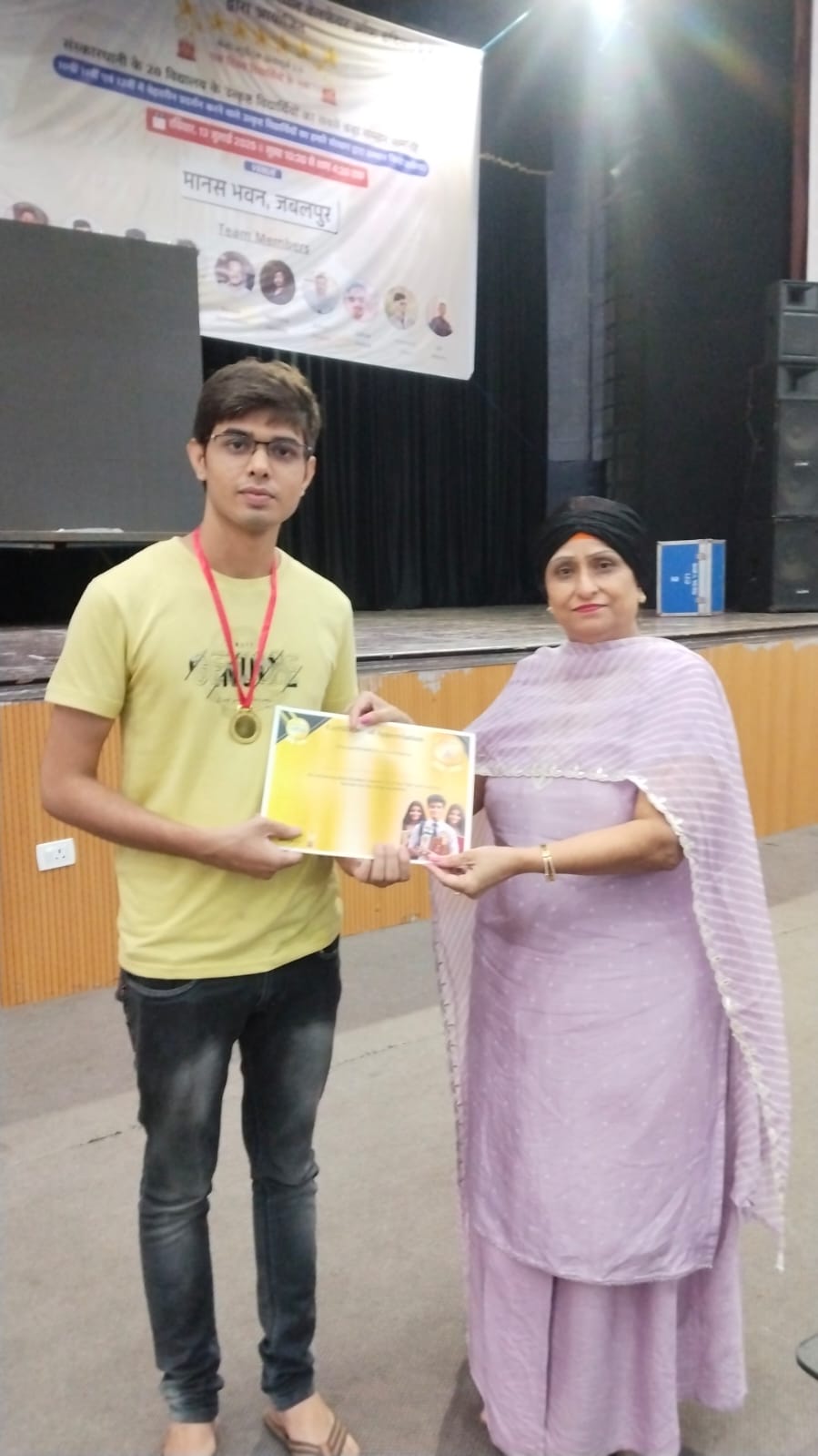 President Amarjeet Kaur Presenting Excellence Award to Scholar